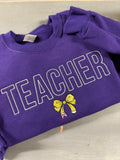 Teacher with pencil bow